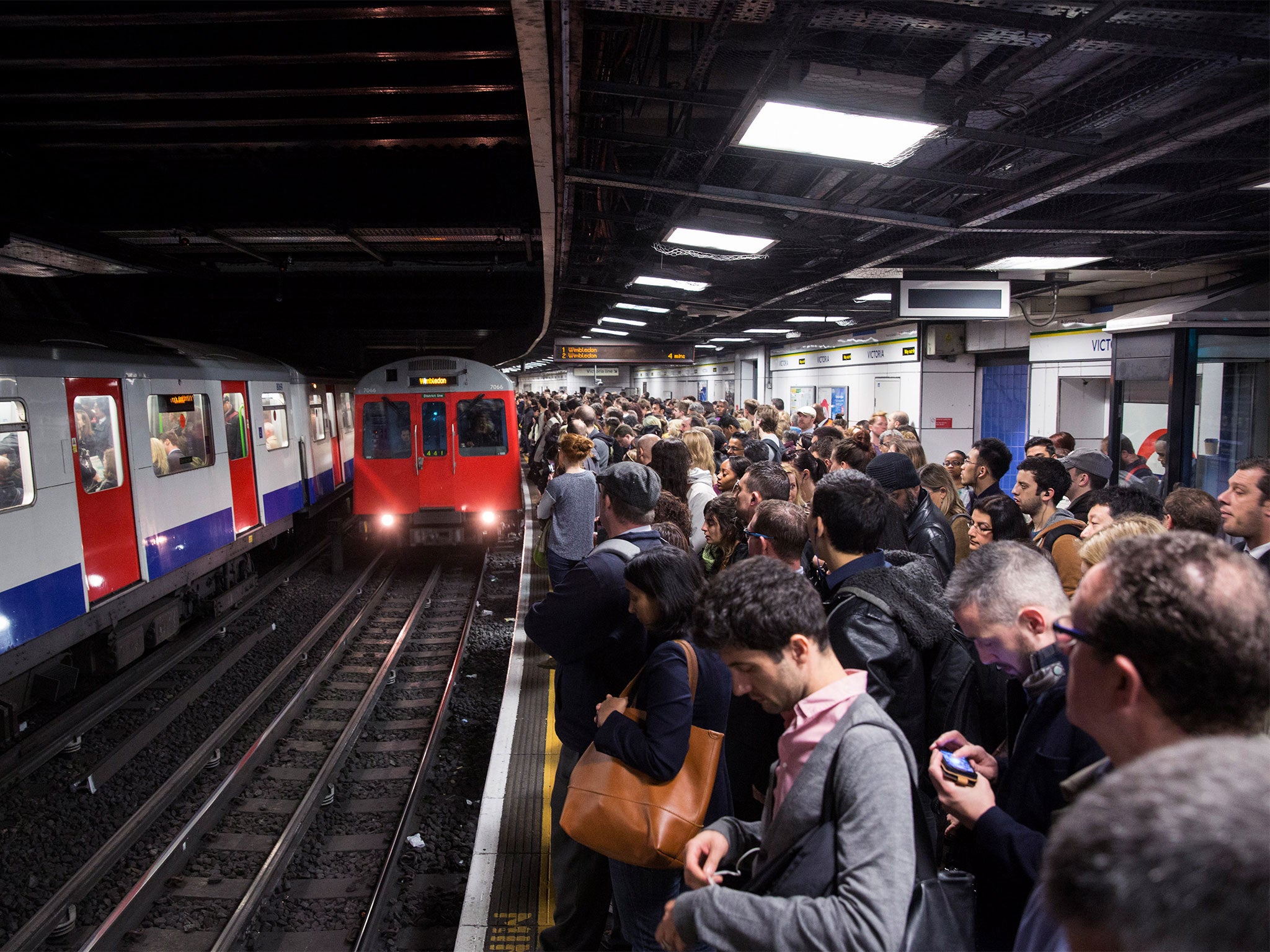 Busy London station platform crowds